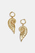 Gold-toned hoop earrings with dangling spiral shell charms.