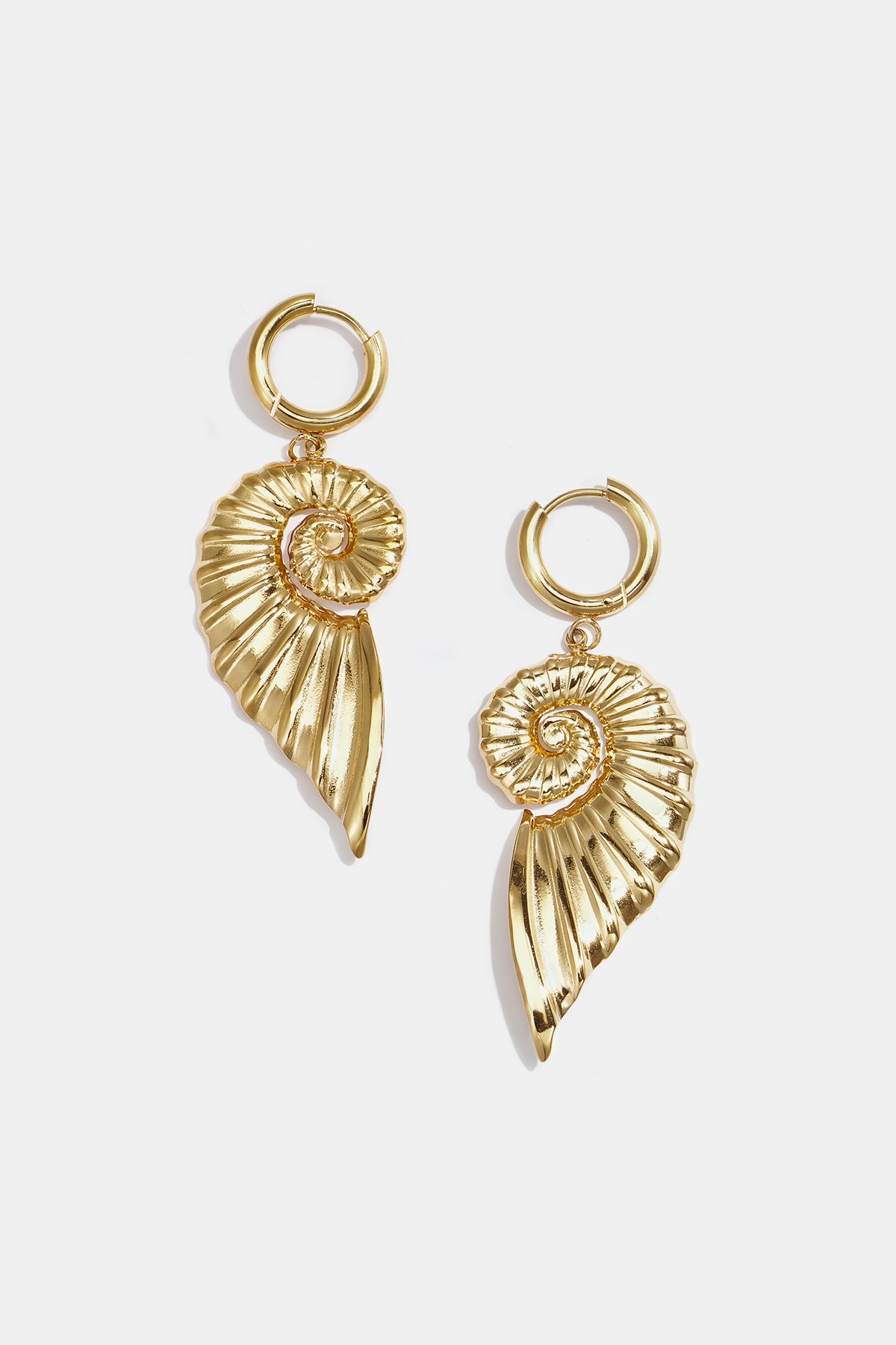 Gold-toned hoop earrings with dangling spiral shell charms.
