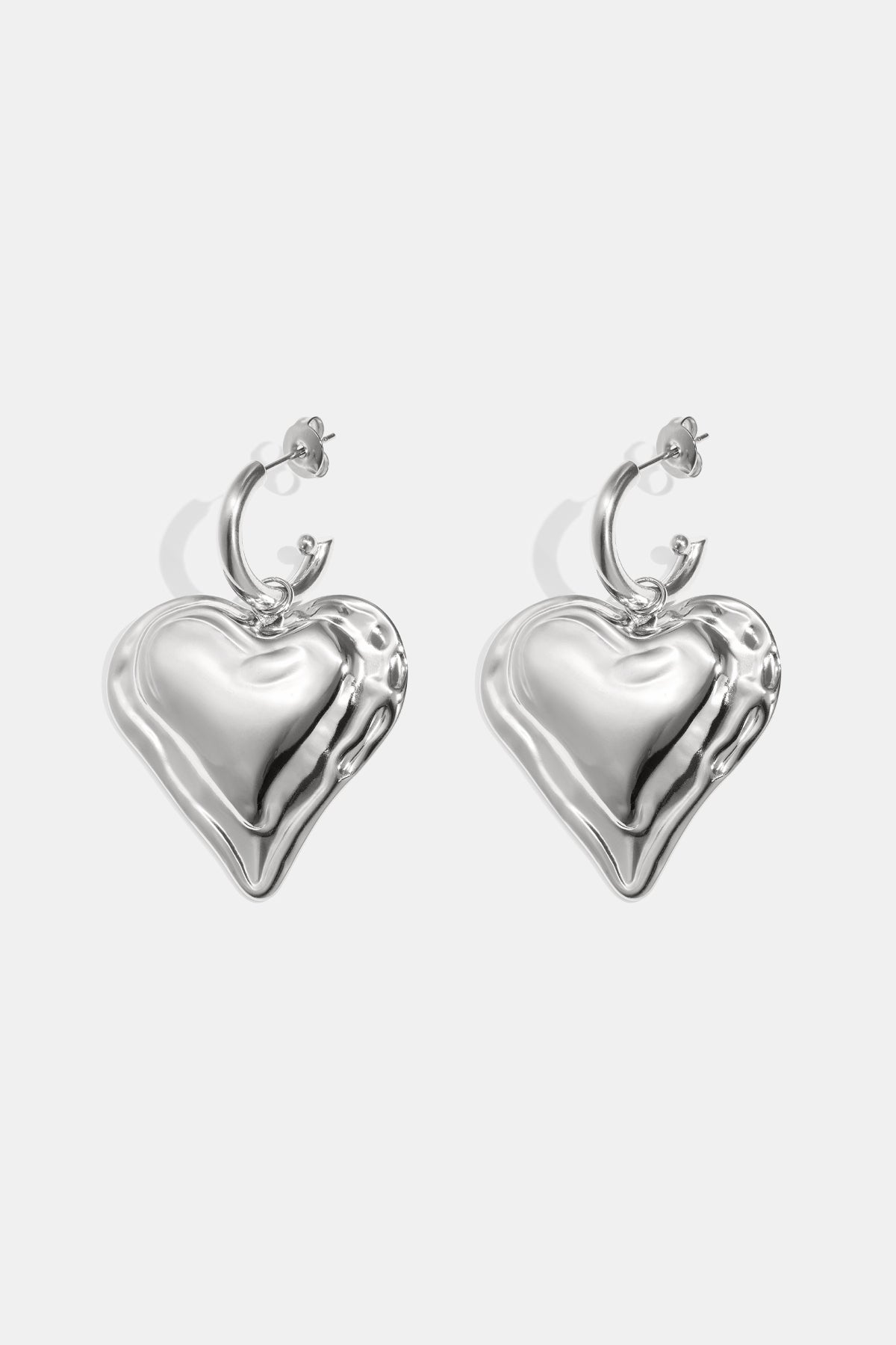 Silver heart drop earrings with hoop backs.