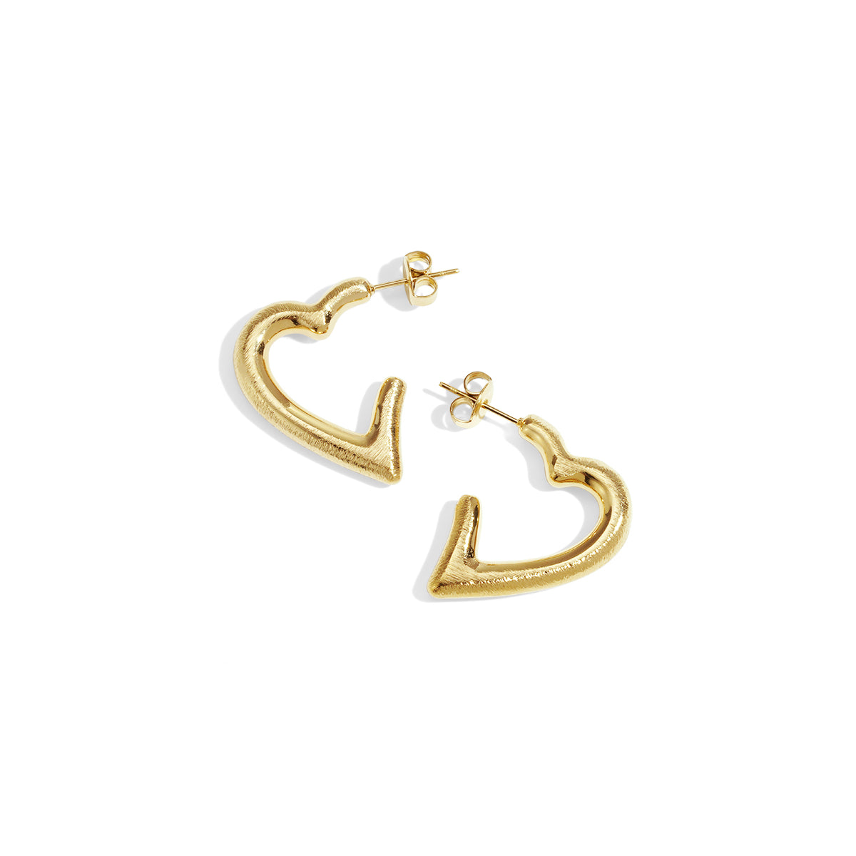Gold heart hoop earrings with post backings on a white background.