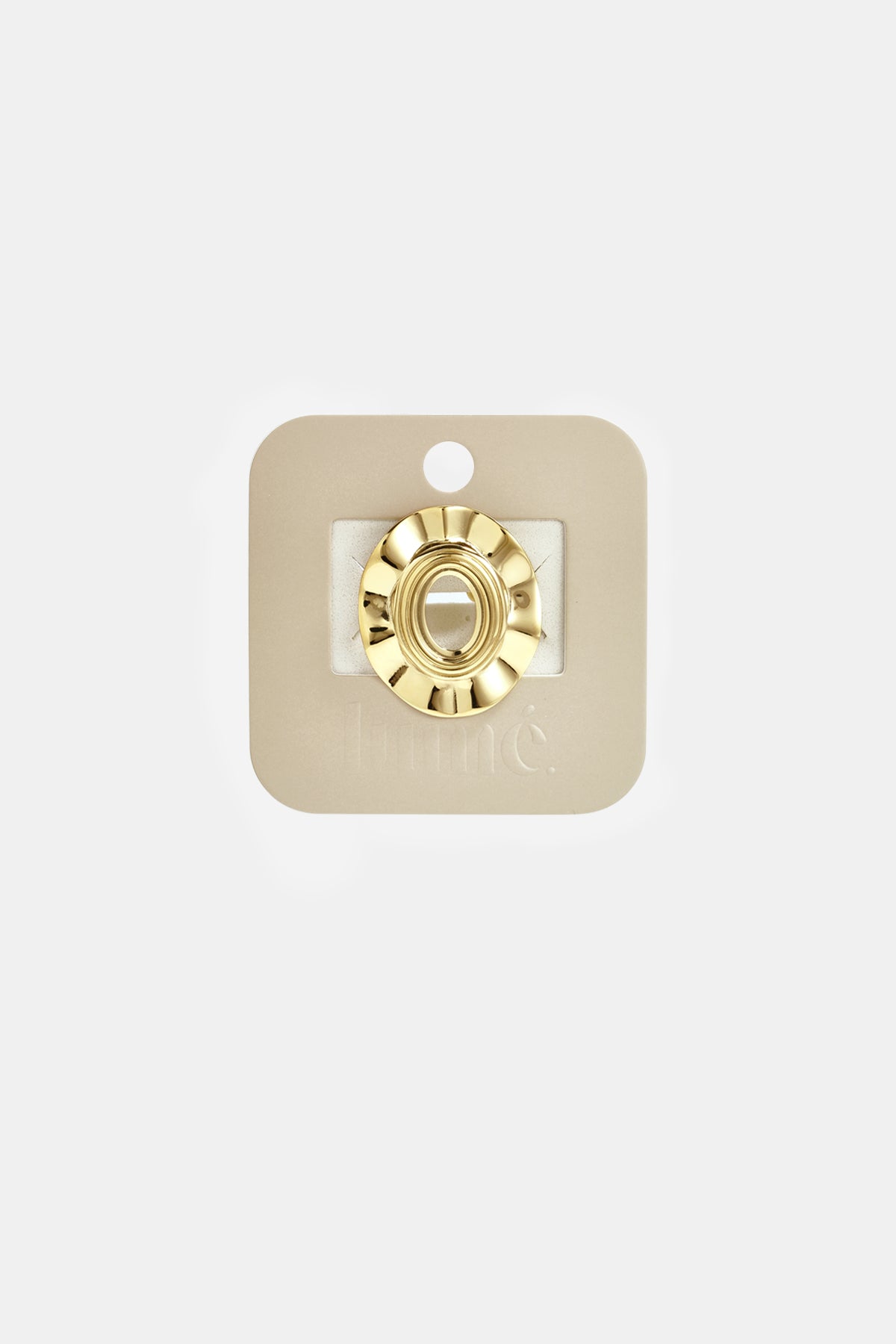 Gold irregular minimalist ring on a beige card.