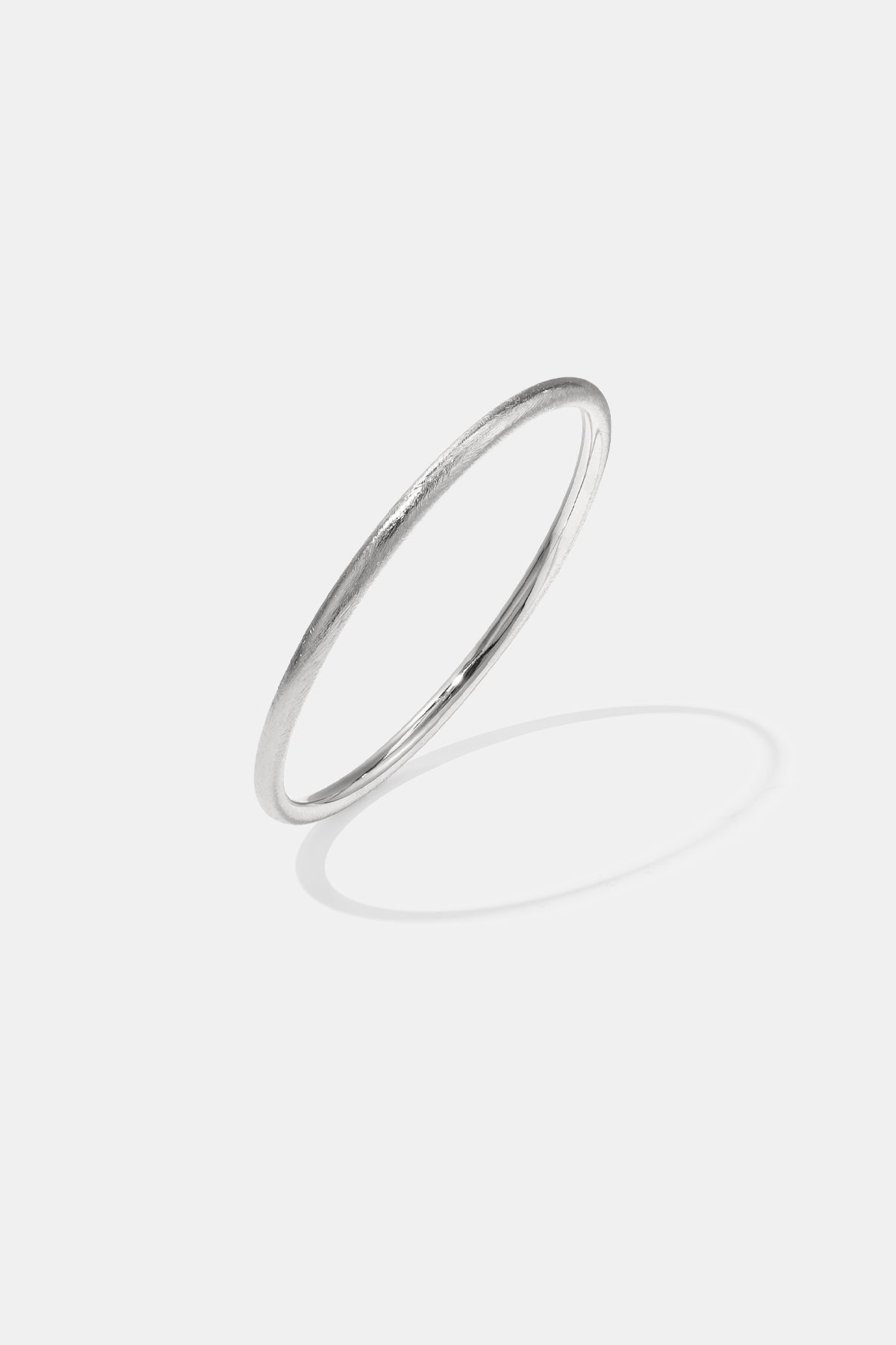 Silver Elara Bangle Bracelet with a brushed finish and 7 mm width.