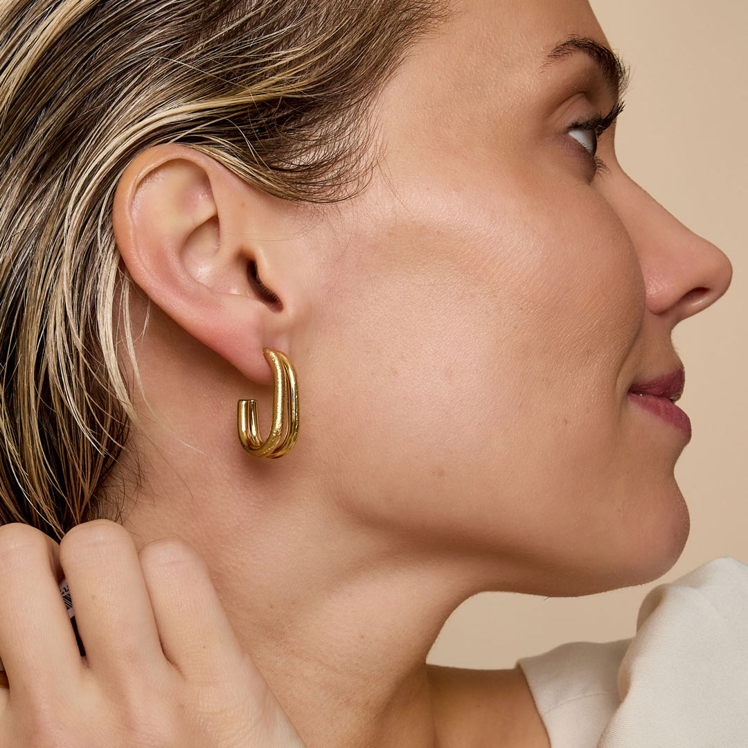 Gold Astra Hoop Earrings with a minimalist, layered design.
