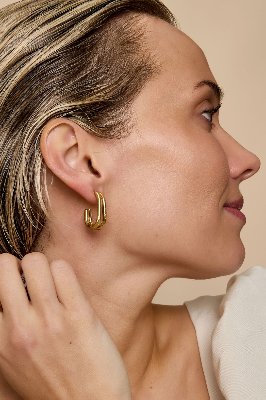 Gold Astra Hoop Earrings with a minimalist, layered design.