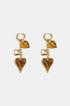 Gold hoop earrings with dangling amber and gold heart charms.