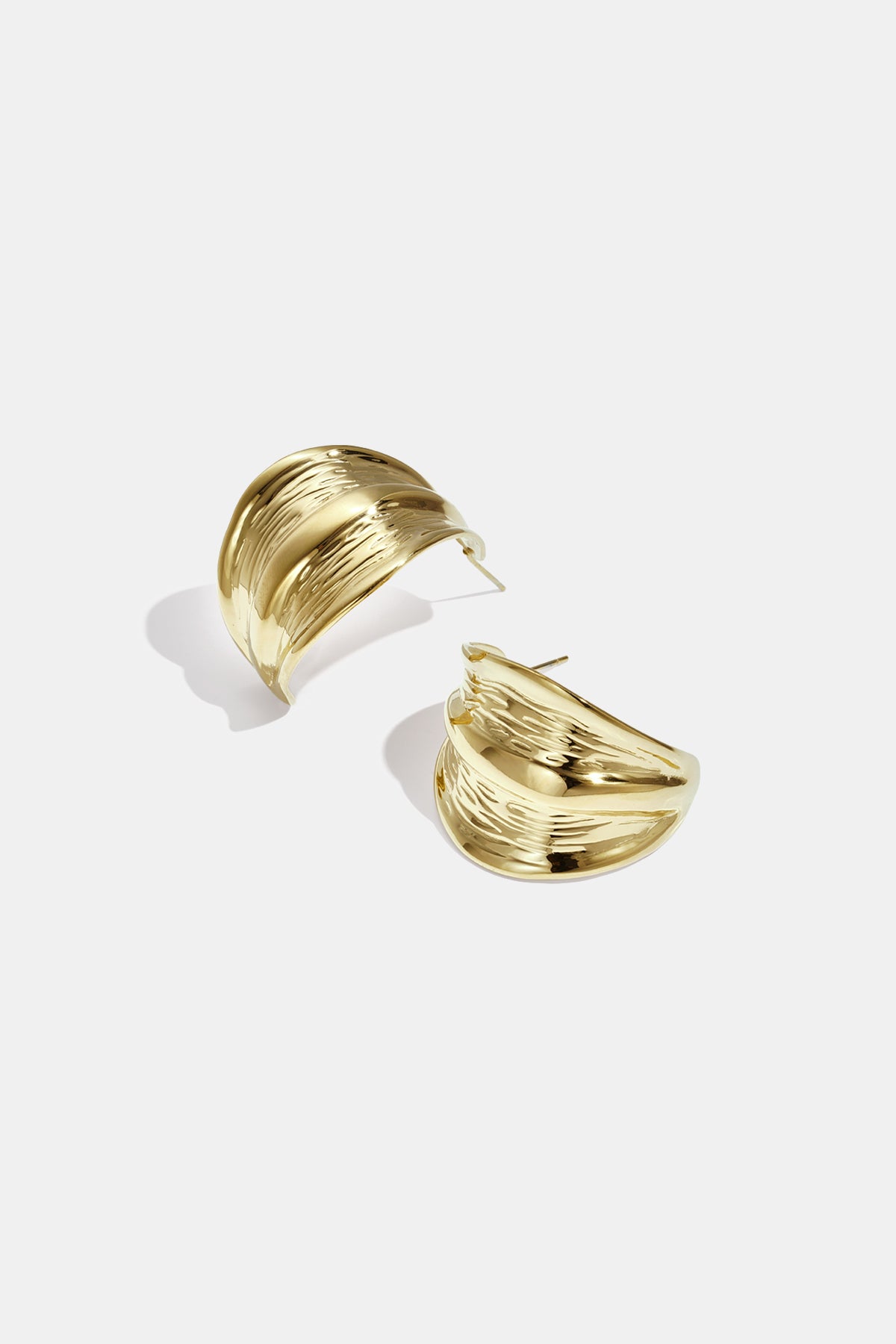 Gold Aurelia Hoop Earrings with a textured, wavy design.