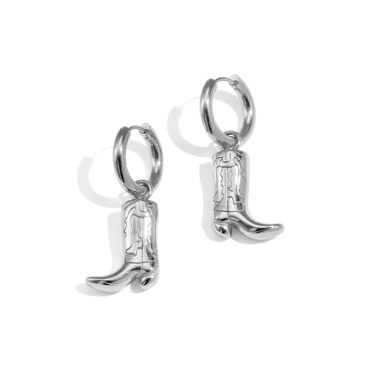 Silver cowboy boot drop earrings with hoop connectors.