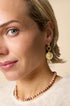 Gold Elysian drop earrings with coin pendant and beaded necklace.
