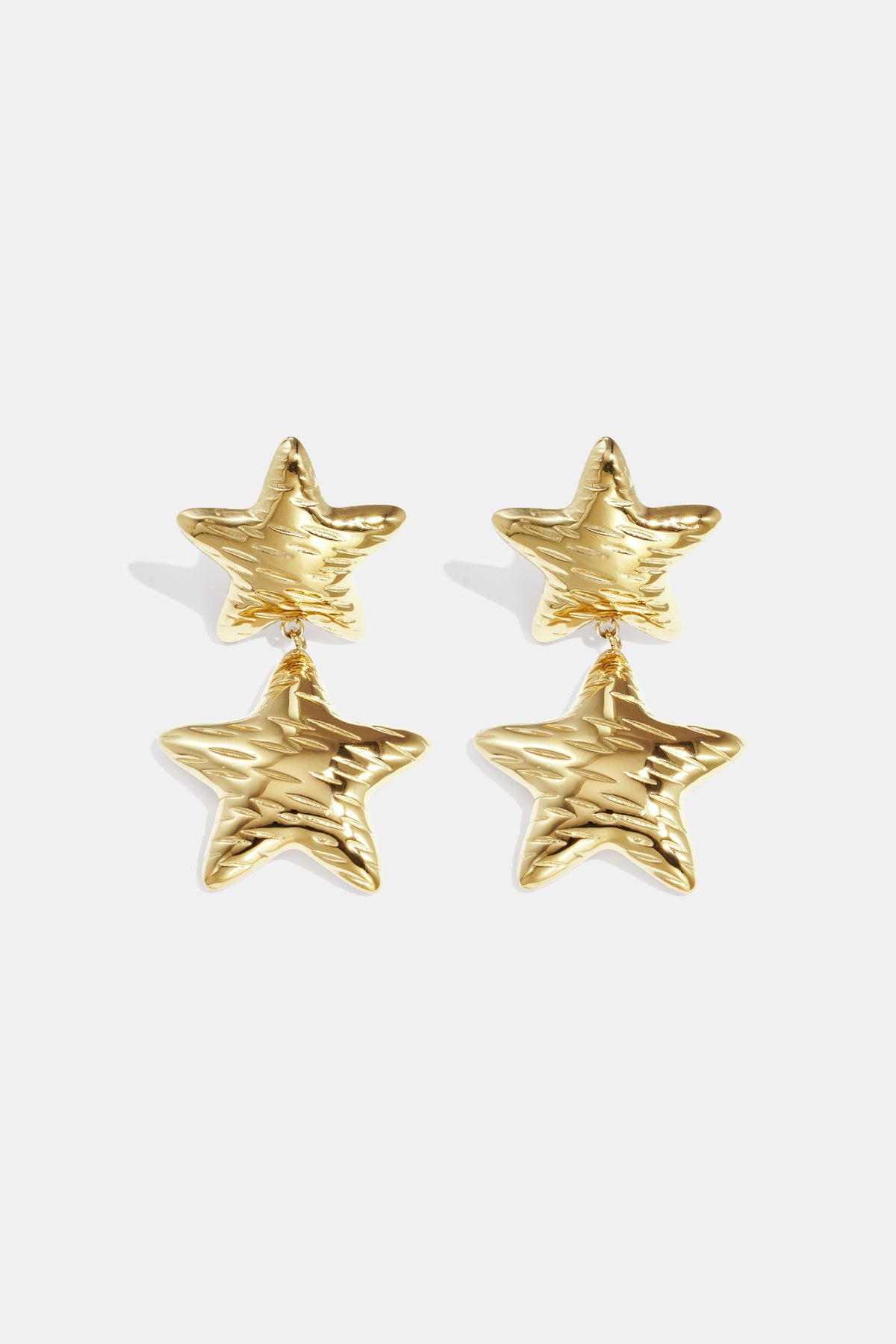 Gold celestial star drop earrings with textured surface, displayed against a white background.