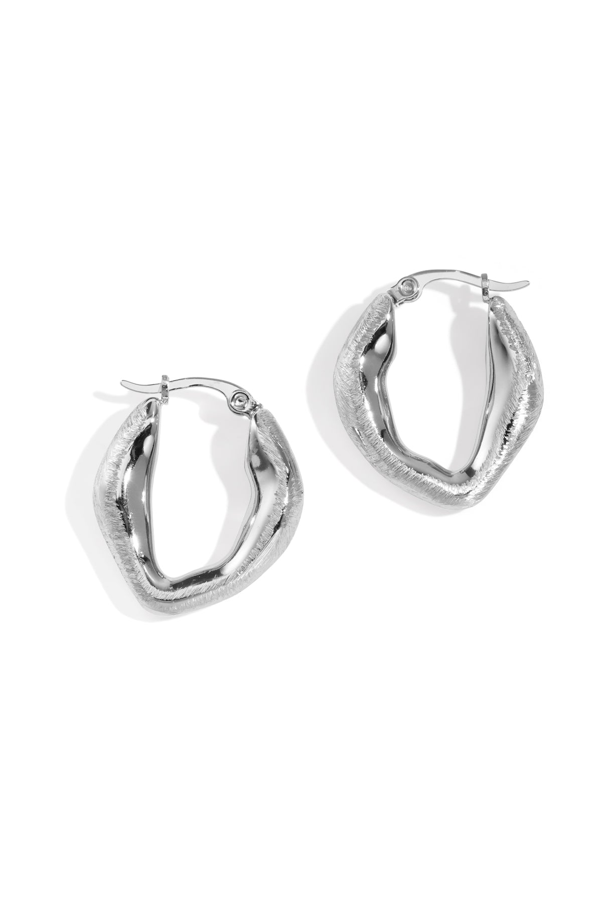 Aurelia Hoop Earrings: a pair of silver, textured, oval-shaped hoop earrings.