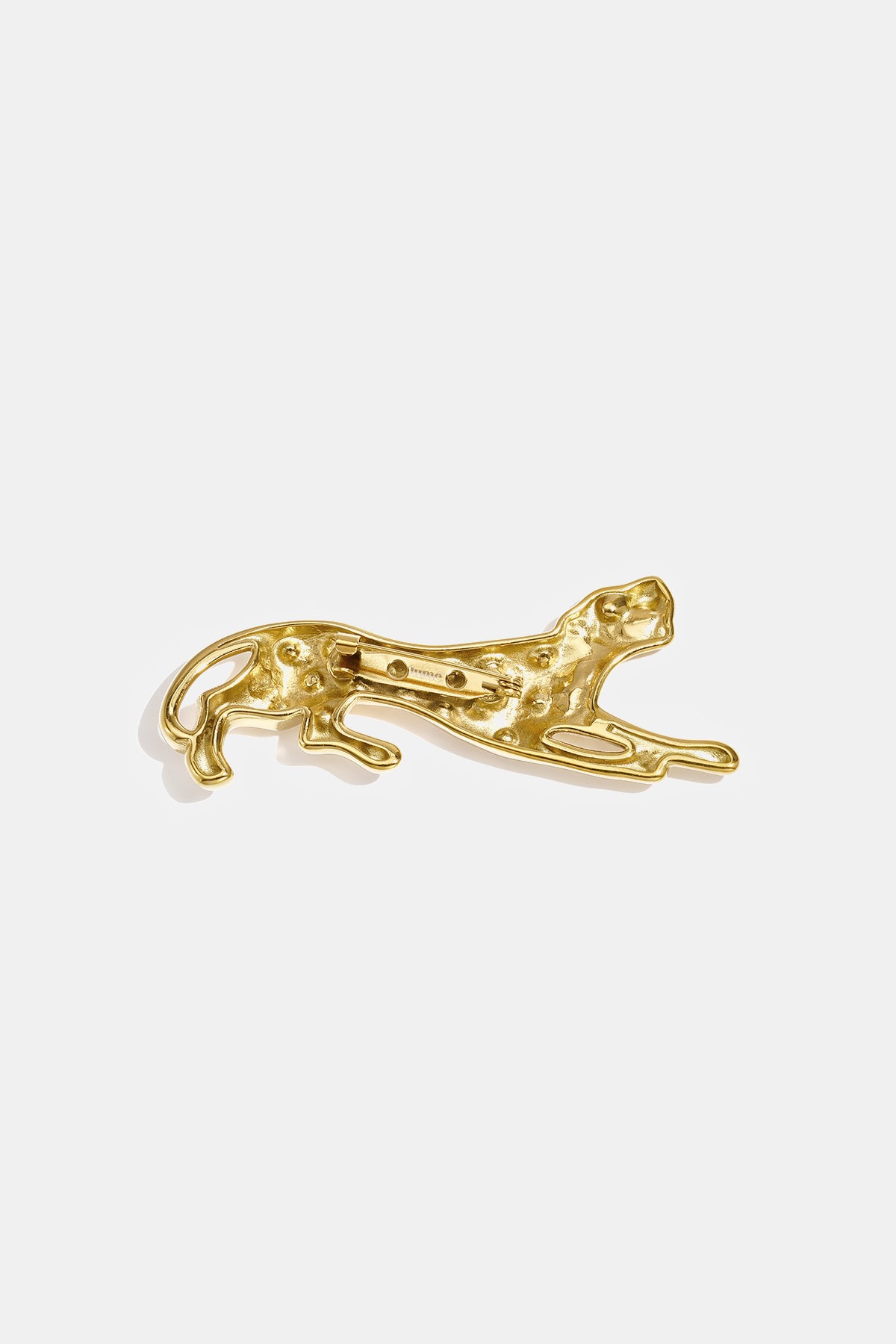Gold-tone brooch shaped like a leopard in a stalking pose, with a pin backing.
