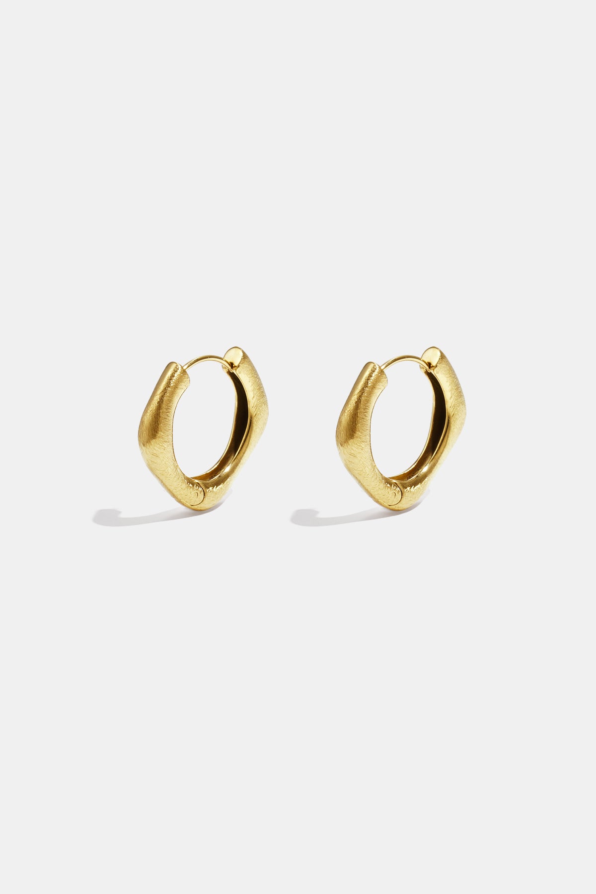 Pair of gold-colored stainless steel hoop earrings with a unique square shape and rounded edges.