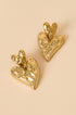 Gold stacked heart stud earrings with textured surface.