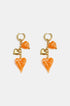 Gold hoop earrings with dangling orange acrylic hearts and gold heart charms.