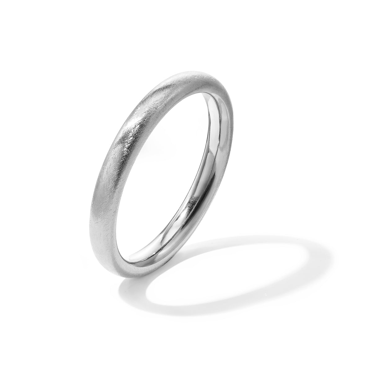 A simple, brushed stainless steel bangle with a subtle sheen, casting a soft shadow on a white background.