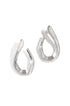 Two silver irregular shaped stud earrings with a brushed finish, casting shadows on a white background.