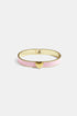 Gold bangle with pink enamel and a gold heart charm.