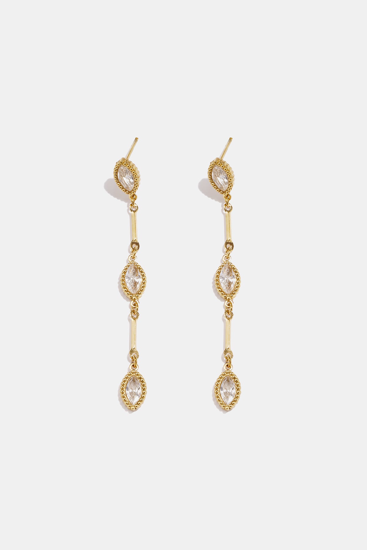 Gold dangle earrings with three marquise-shaped clear stones linked by gold bars.