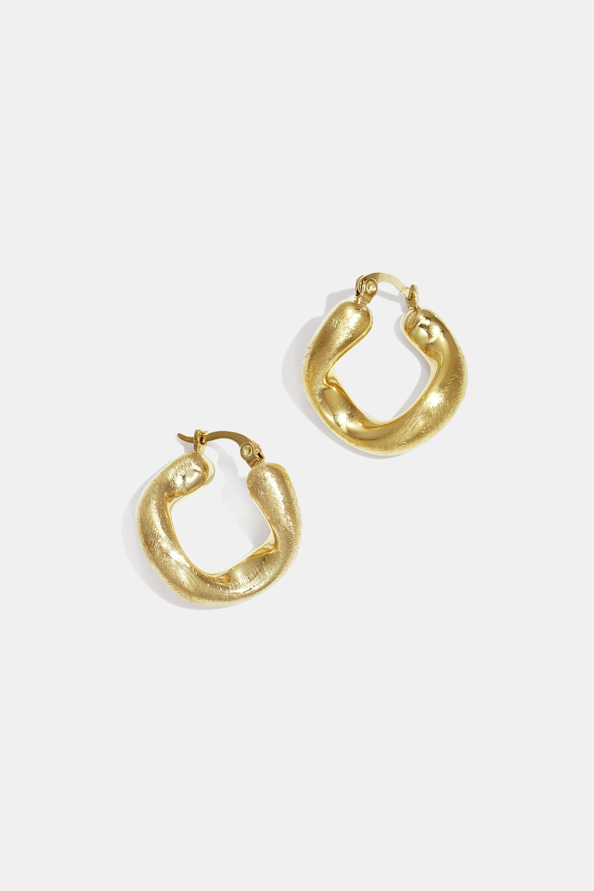 Gold irregular circle hoop earrings with a textured finish, shown against a white background.