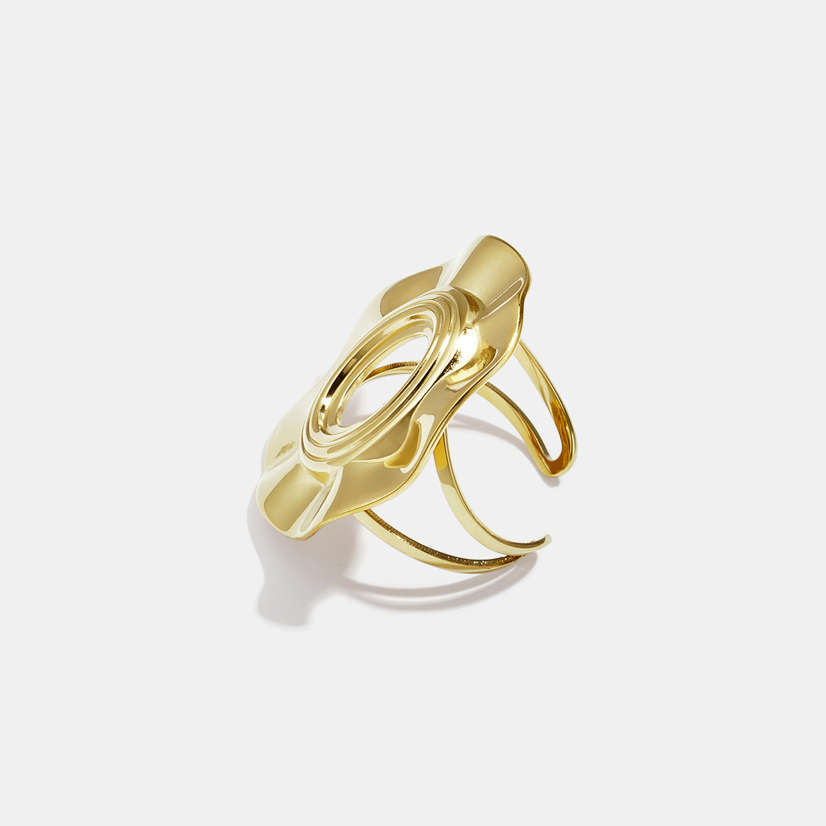 Gold irregular minimalist ring with an oval cutout and textured surface.