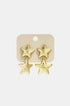 Gold celestial star drop earrings on a beige card with "PREMIUM JEWELRY" printed on it.