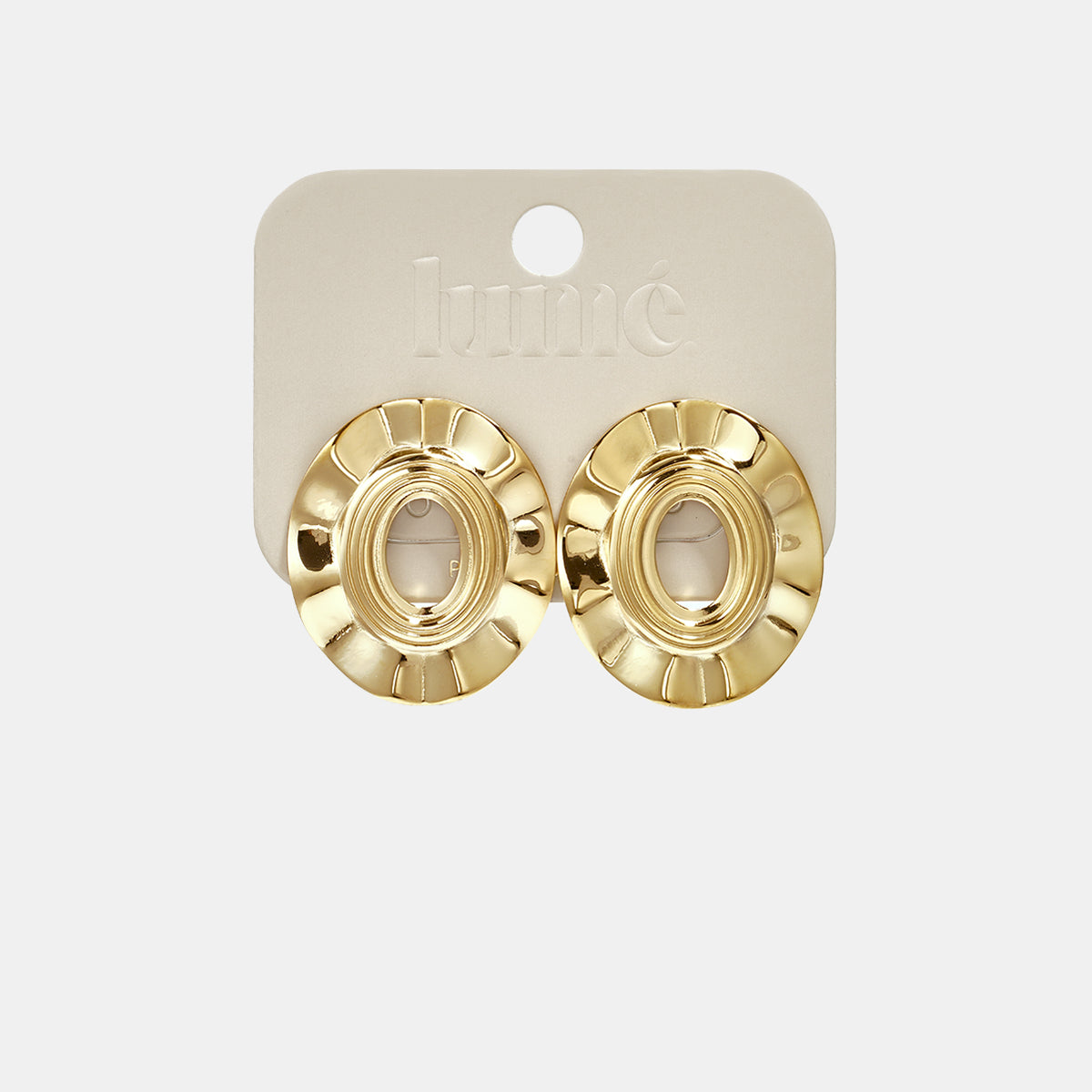Gold irregular shape stud earrings with a textured circular design on a light beige card.