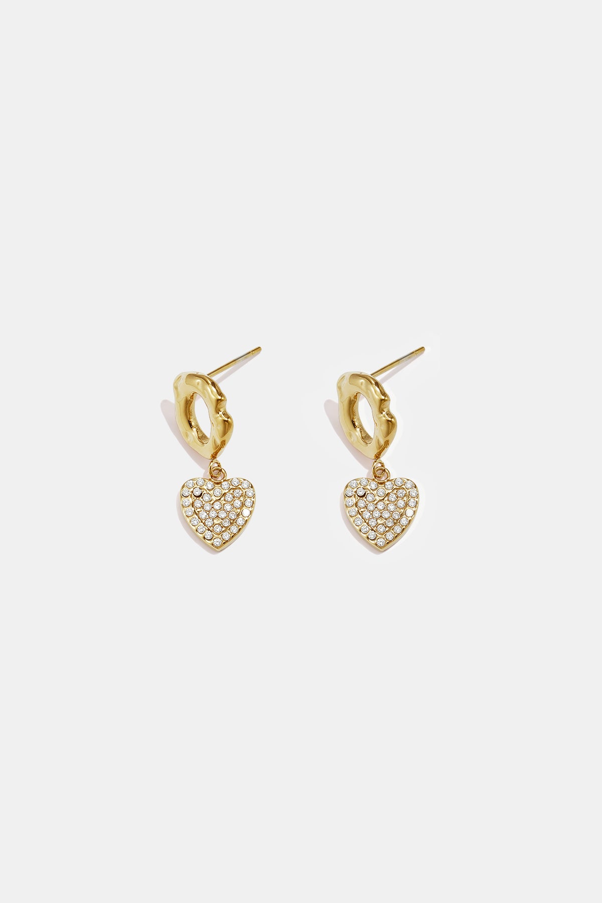 Gold heart drop earrings with clear stones and textured gold hoops.