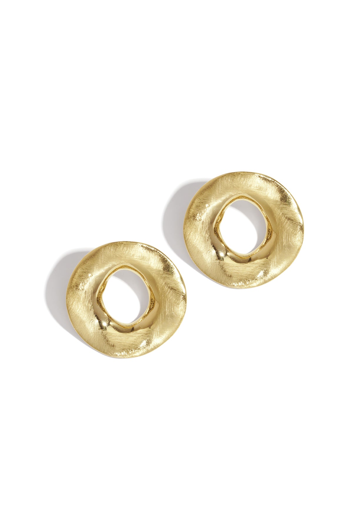Two gold-colored, textured, circular Aura Statement Earrings on a white background.