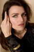 Elara Bangle Bracelet in gold, 7 mm wide, with a brushed finish.
