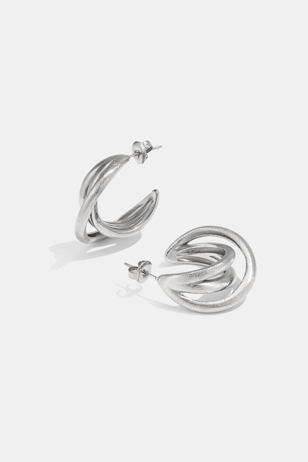 Silver Astra Hoop Earrings with a twisted, layered design.