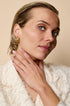 Astra Hoop Earrings: Gold-plated stainless steel hoop earrings with a textured finish.