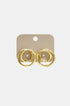 Gold spiral circle stud earrings on a beige backing card with the brand name 'lume.' visible.