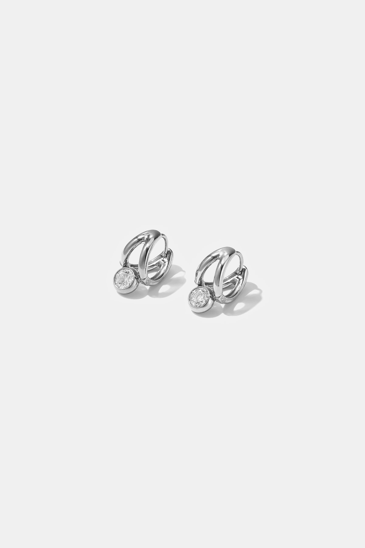 Ondine Irregular Hoop Earrings with a single clear stone on each.