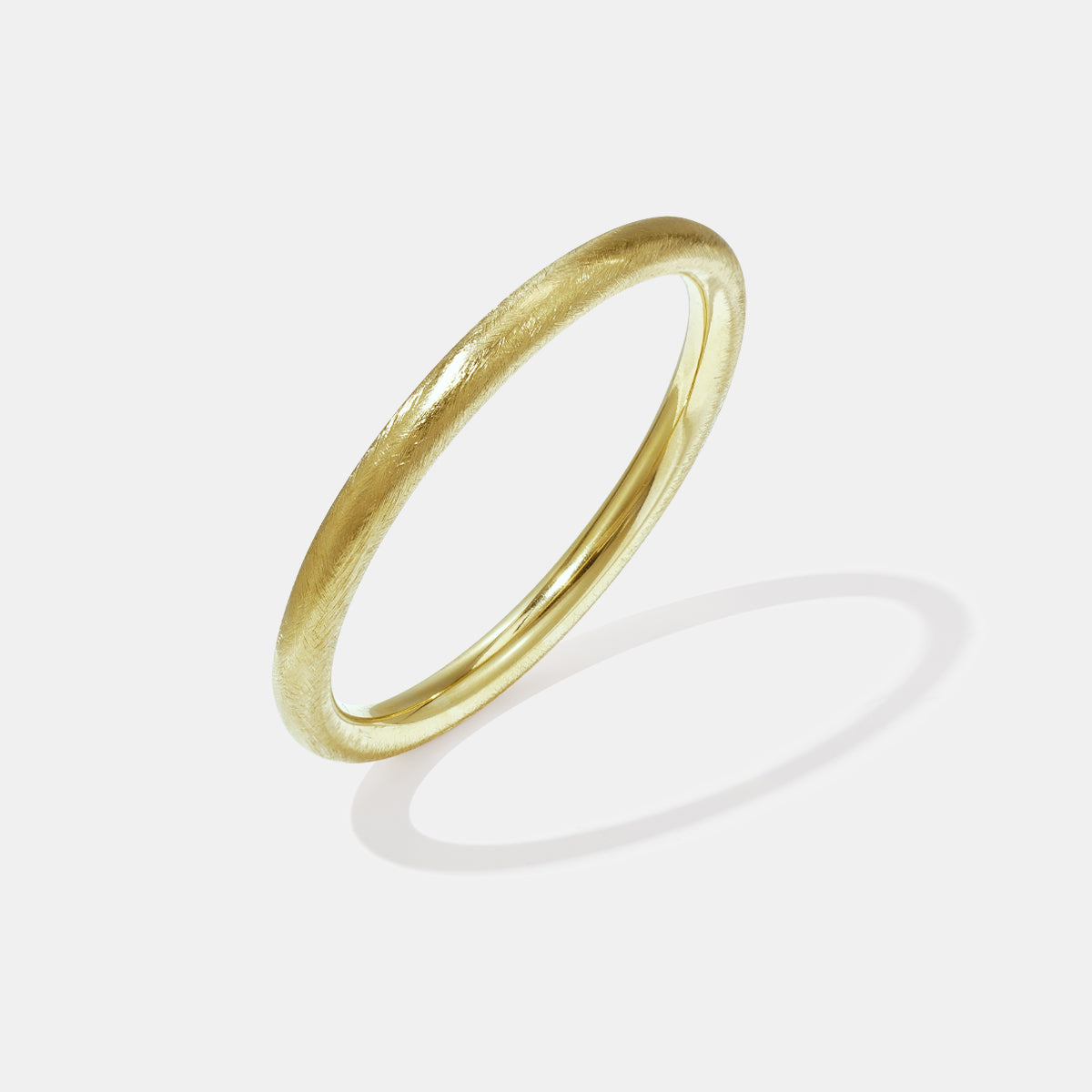 Gold bangle bracelet with a brushed finish and 10 mm width.
