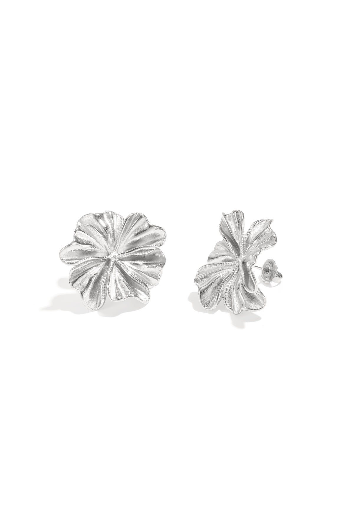 Two silver stud earrings shaped like delicate, textured flower petals.