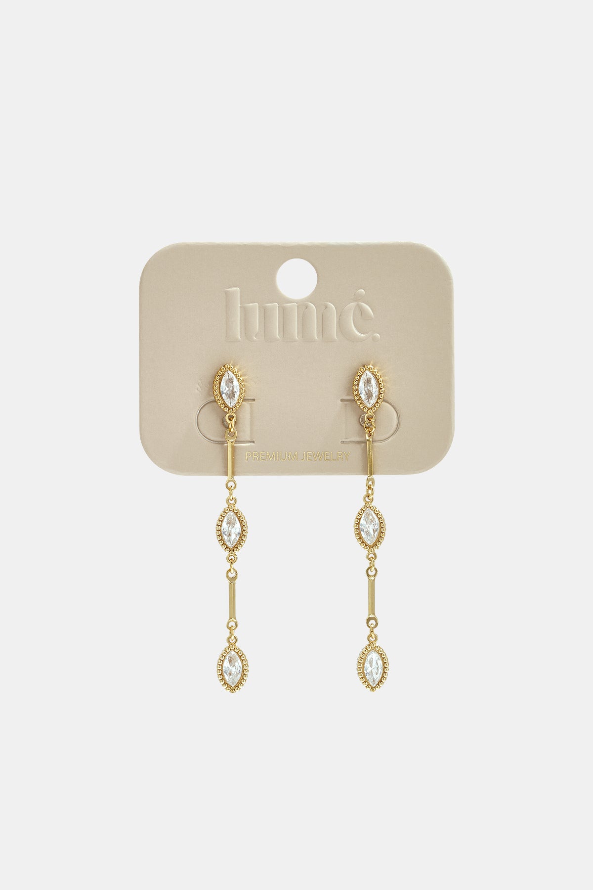Gold dangle earrings with three marquise-shaped clear stones on each earring.