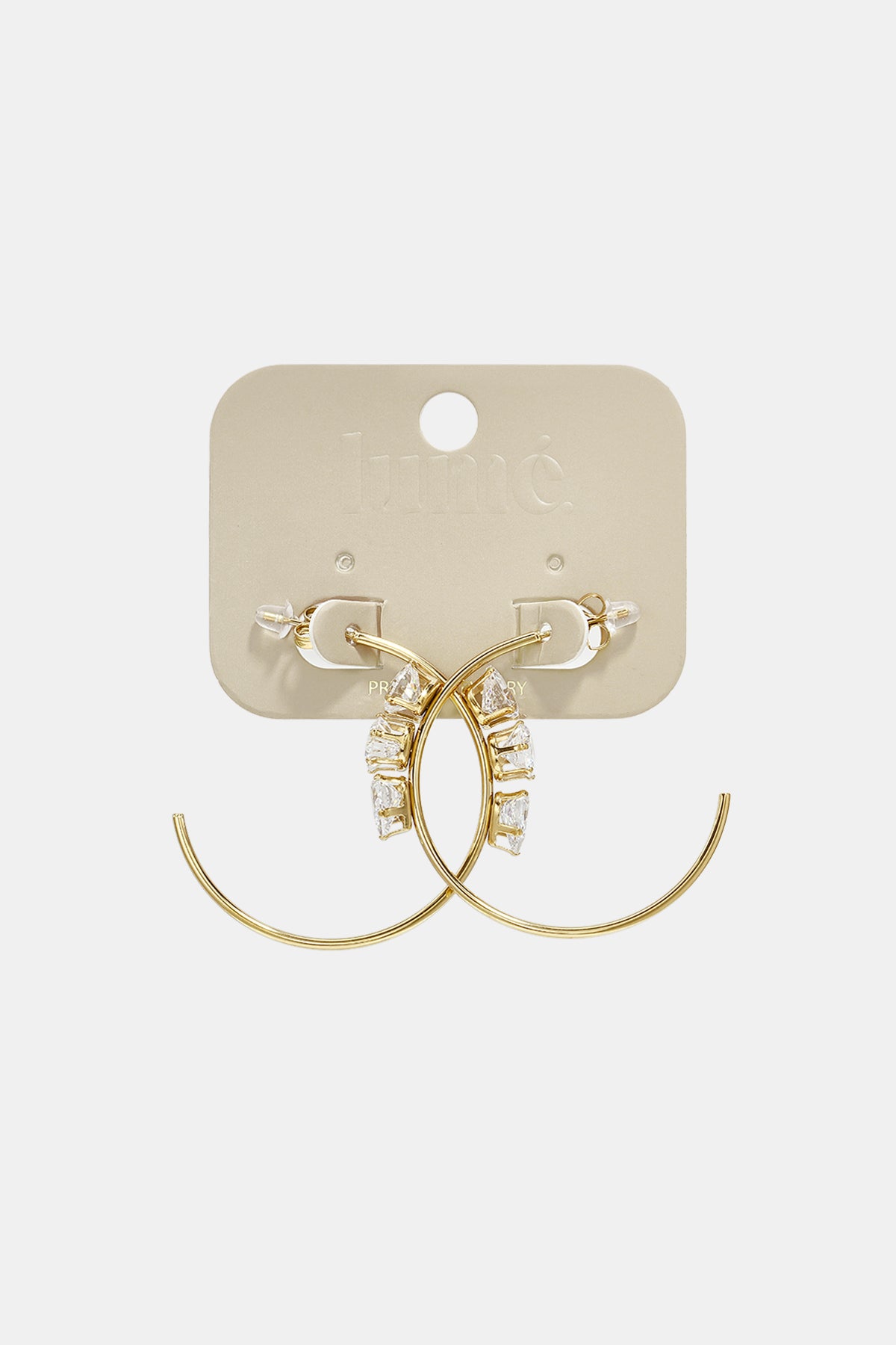 Gold hoop earrings with clear cubic zirconia stones on a beige card.
