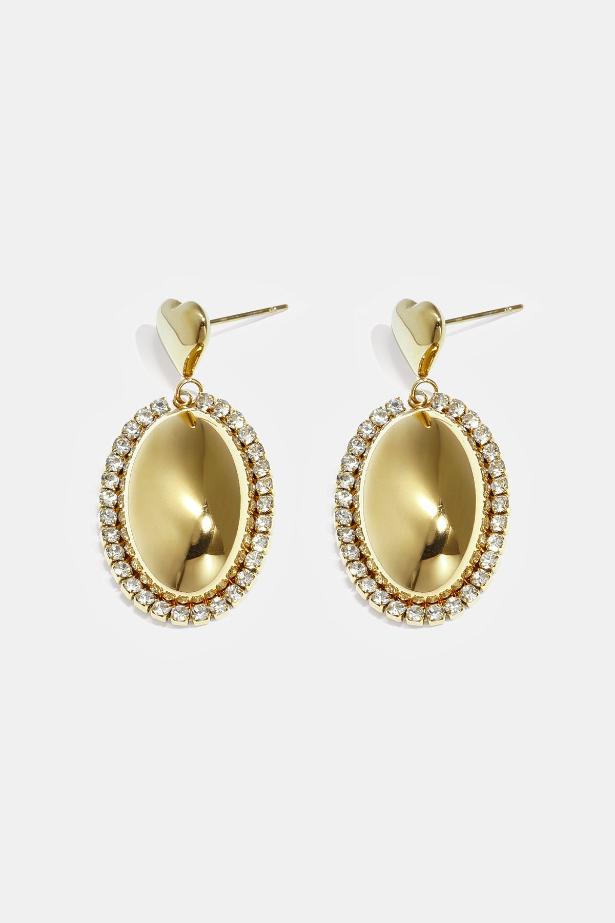 Gold oval earrings with rhinestones and heart-shaped studs.