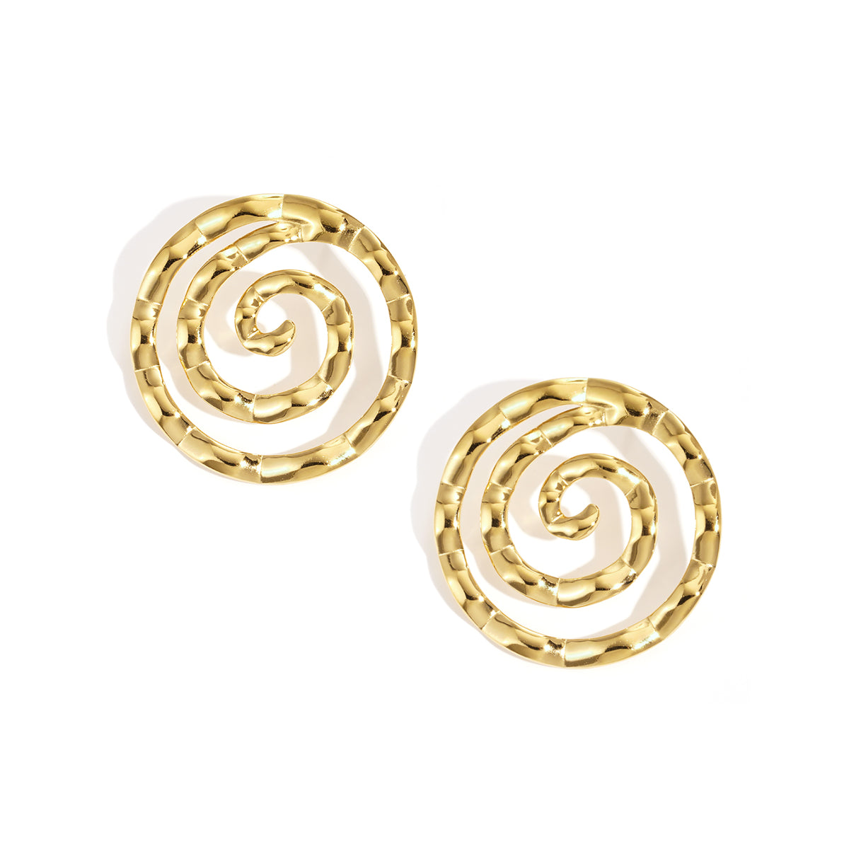 Gold spiral circle stud earrings with a hammered texture.
