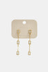 Gold Elara Geometric Earrings with clear rectangular zircon stones and gold chain links.