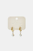 Gold hoop earrings with a dangling pear-shaped zircon and a smaller round zircon.
